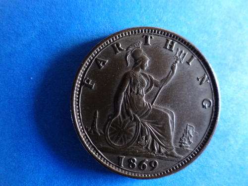 A BEAUTIFUL 1869 BRITISH FARTHING IN UNCIRCULATED CONDITION. ENLARGED IMAGES.